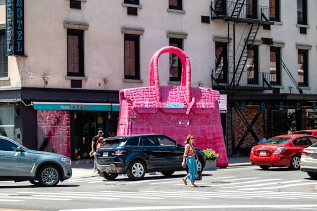 A giant pink Birkin-inspired handbag sculpture in New York.
